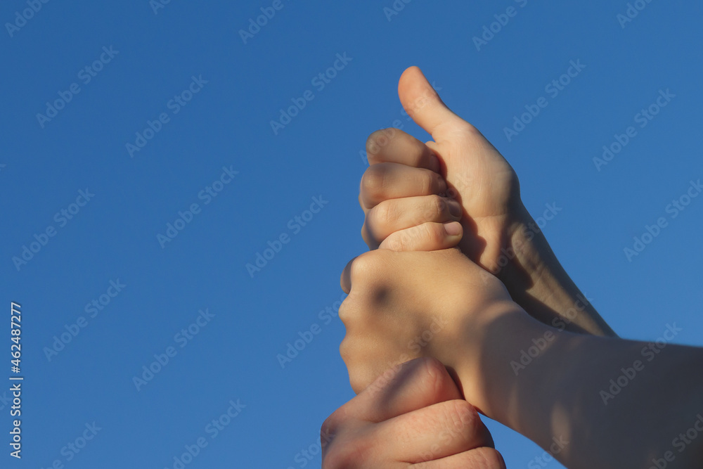 The team of players put their hands together as a sign of unity and support The team of players put their hands together as a sign of unity and support