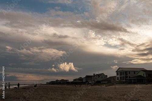 Beach homes and dramatic clouds by the Ocean