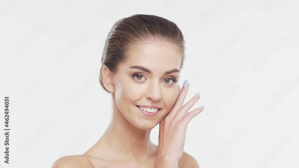 Beauty portrait of young, attractive and healthy woman. Brunette girl over white background. Natural female face. Beauty portrait of young, attractive and healthy woman. Brunette girl over white background. Natural female face.