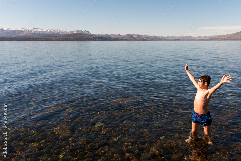 Young man enjoying the summer at Lake Nahuel Huapi, Bariloche, Patagonia.