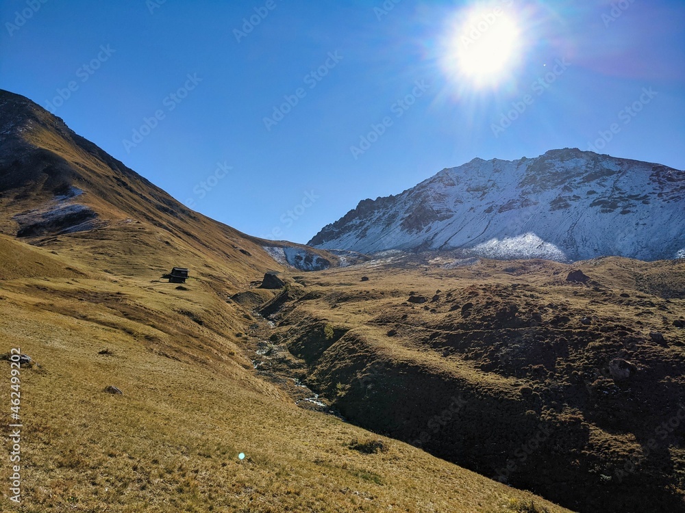 hike in autumn in the canton of graubunden. Snow-covered mountains and beautiful fields in the sunshine. Alp. Ducan ,Davos, Monstein hike in autumn in the canton of graubunden. Snow-covered mountains and beautiful fields in the sunshine. Alp. Ducan ,Davos, Monstein