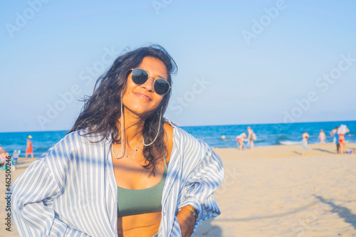 Young indian woman happy in the beach