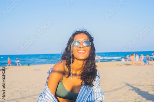 Young indian woman happy in the beach