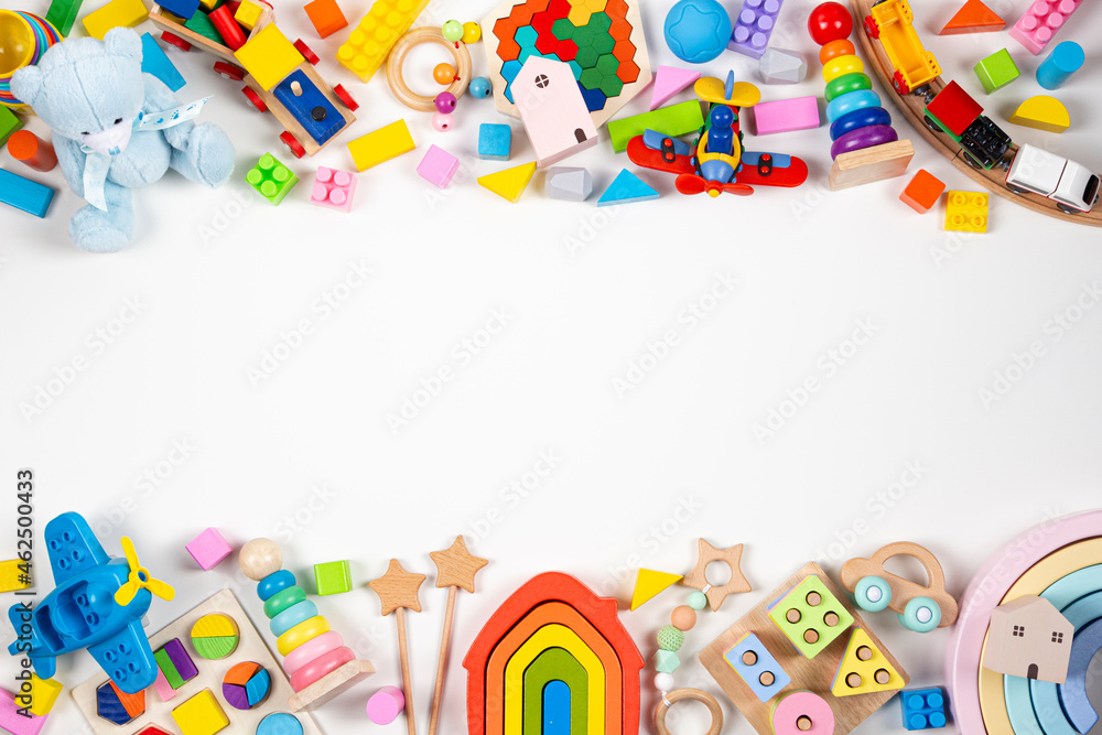 Baby kids toy frame. Many colorful educational toys on white background. Top view, flat lay, copy space for text Baby kids toy frame. Many colorful educational toys on white background. Top view, flat lay, copy space for text