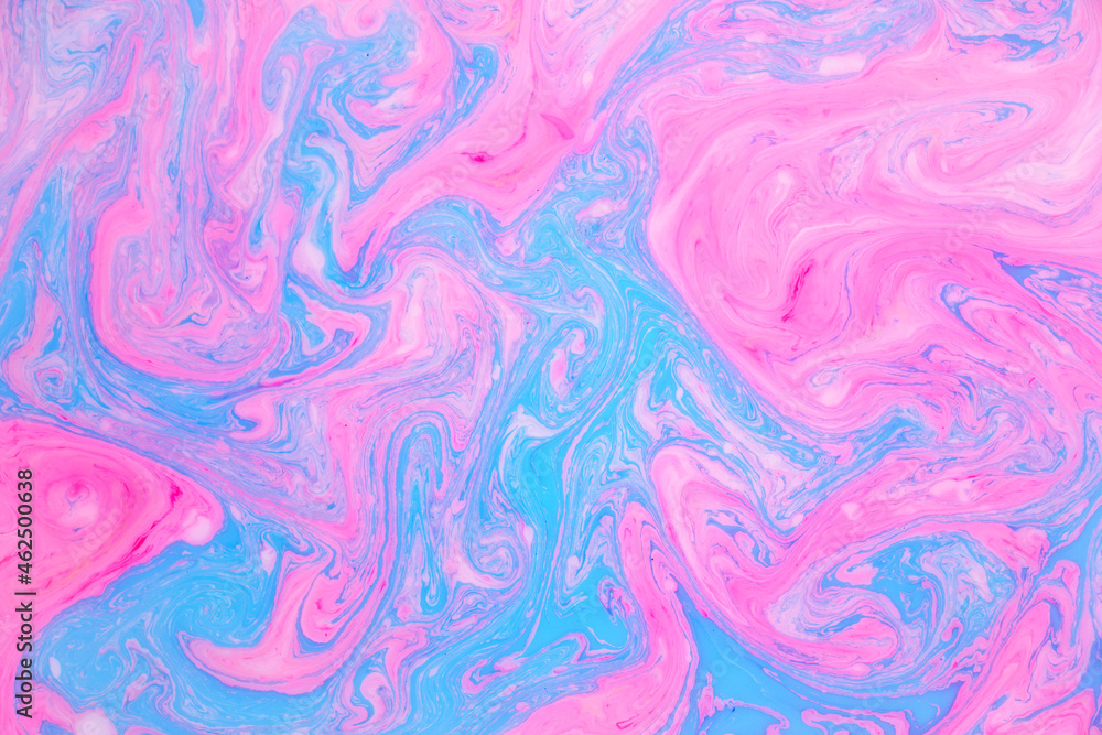 Abstract colored marble background, stains of pink and blue paint on the surface of the water. Liquid colorful backdrop. Abstract colored marble background, stains of pink and blue paint on the surface of the water. Liquid colorful backdrop.