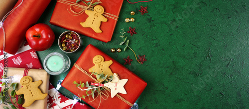 Christmas holiday framed border banner. Christmas red and green theme gift wrapping top view blog hero header creative composition flat lay. Negative copy space.