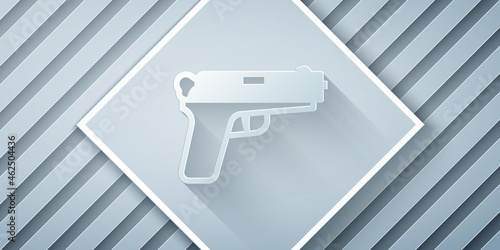 Paper cut Pistol or gun icon isolated on grey background. Police or military handgun. Small firearm. Paper art style. Vector