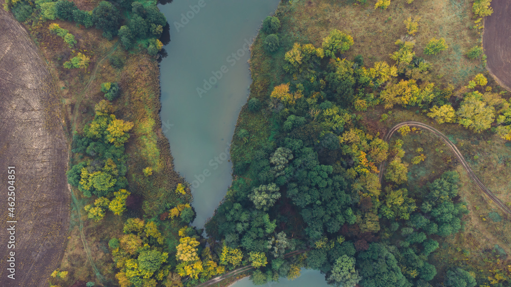 Aerial view of two lake and autumn forests on morning. Place for fishing