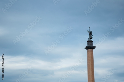 Alexander column on the Palace square against the blue sky in Saint Petersburg.