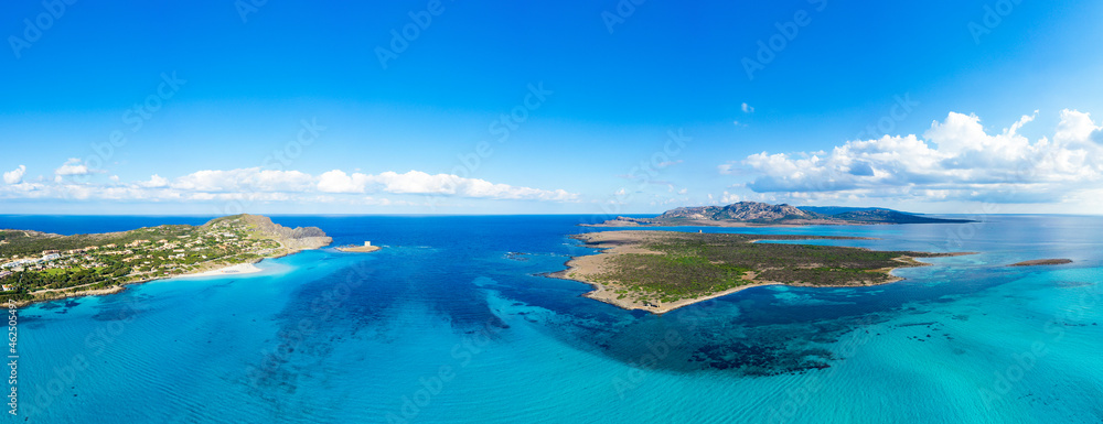 View from above, aerial shot, stunning panoramic view of La Pelosa Beach and the Asinara island bathed by a turquoise, crystal clear water. Spiaggia La Pelosa, Stintino, north-west Sardinia, Italy.