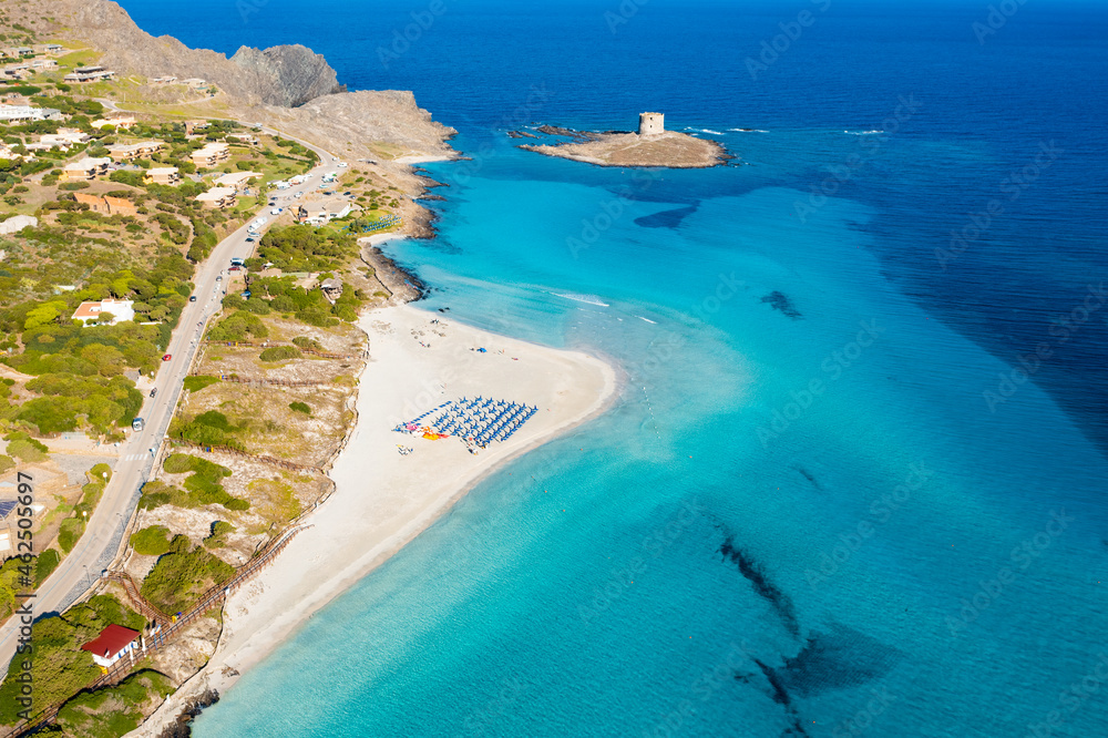 View from above, stunning aerial aerial view of La Pelosa Beach bathed by a turquoise, crystal clear water. Spiaggia La Pelosa, Stintino, north-west Sardinia, Italy.