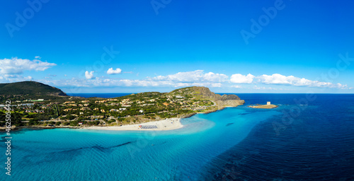 View from above, aerial shot, stunning panoramic view of La Pelosa Beach bathed by a turquoise, crystal clear water. Spiaggia La Pelosa, Stintino, north-west Sardinia, Italy.