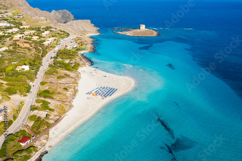 Obraz na płótnie View from above, stunning aerial aerial view of La Pelosa Beach bathed by a turquoise, crystal clear water. Spiaggia La Pelosa, Stintino, north-west Sardinia, Italy. w salonie