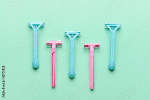 Many different razors for depilation on blue background