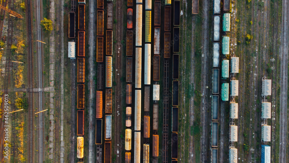 Aerial View. Old defective and looted railway wagons stand on the territory of the repair depot awaiting repairs. Poor business management. Ukrainian railway, DVRZ. Aerial View. Old defective and looted railway wagons stand on the territory of the repair depot awaiting repairs. Poor business management. Ukrainian railway, DVRZ.