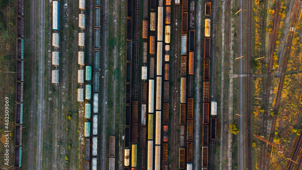 Aerial View. Old defective and looted railway wagons stand on the territory of the repair depot awaiting repairs. Poor business management. Ukrainian railway, DVRZ. Aerial View. Old defective and looted railway wagons stand on the territory of the repair depot awaiting repairs. Poor business management. Ukrainian railway, DVRZ.
