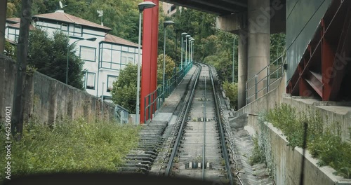 Public transport of a cable car located in Bilbao, Spain. Tracks of an aerial cable car that goes up. Subjective plane.
