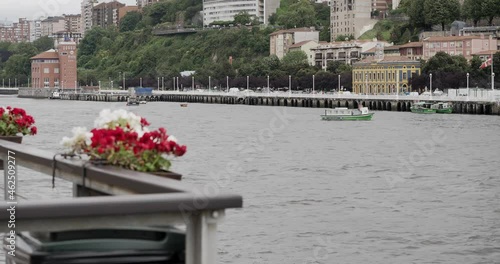 Bilbao river is crossed by boats. Urban and industrial life. European and Spanish trade. Boat cruise in Bilbao.