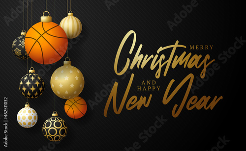 basketball Christmas card. Merry Christmas sport greeting card. Hang on a thread basketball ball as a xmas ball and golden bauble on black horizontal background. Sport Vector illustration.