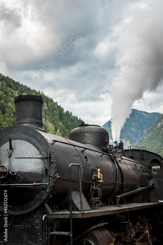 Old fashioned train vagon and Steam locomotive in the station of Brunico Bruneck in Val Pusteria - Pustertal, Trentino Alto Adige, Südtirol - South Tyrol, Italy