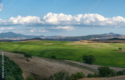 Tuscany, Italy. August 2020. Amazing landscape of the Tuscan countryside with the typical rolling hills and cypresses to mark the boundaries.