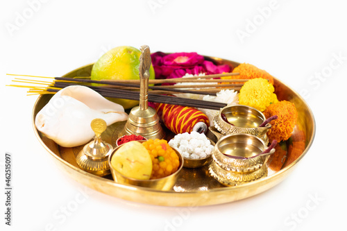 Decorated Golden Pooja Ki Thali Decorated With Mithai, Diya, Deep, Flowers, Genda Phool, Shankh, Roli, Kumkum, Agarbatti, Ghanti, Raksha, Moli. Theme For Navratri, Dussehra Puja, Karva Chauth, Teej photo