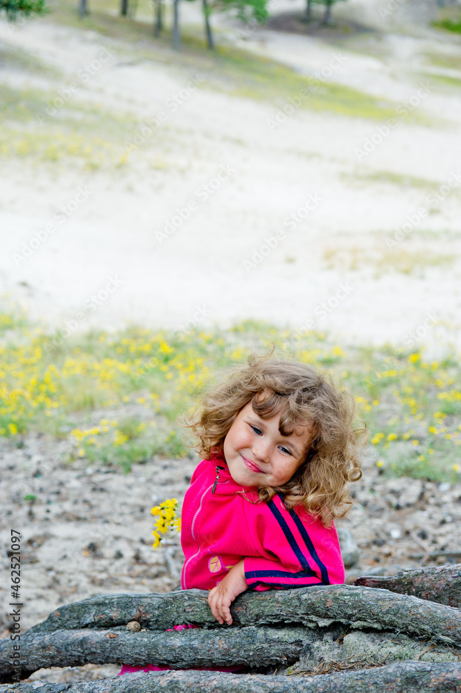 little child playing on the sand little child playing on the sand