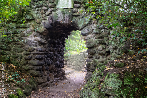 Ancient stone archway in Woerlitzer Park, Dessau, Germany photo