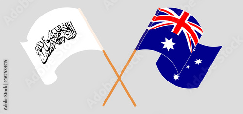 Crossed and waving flags of Taliban and Australia