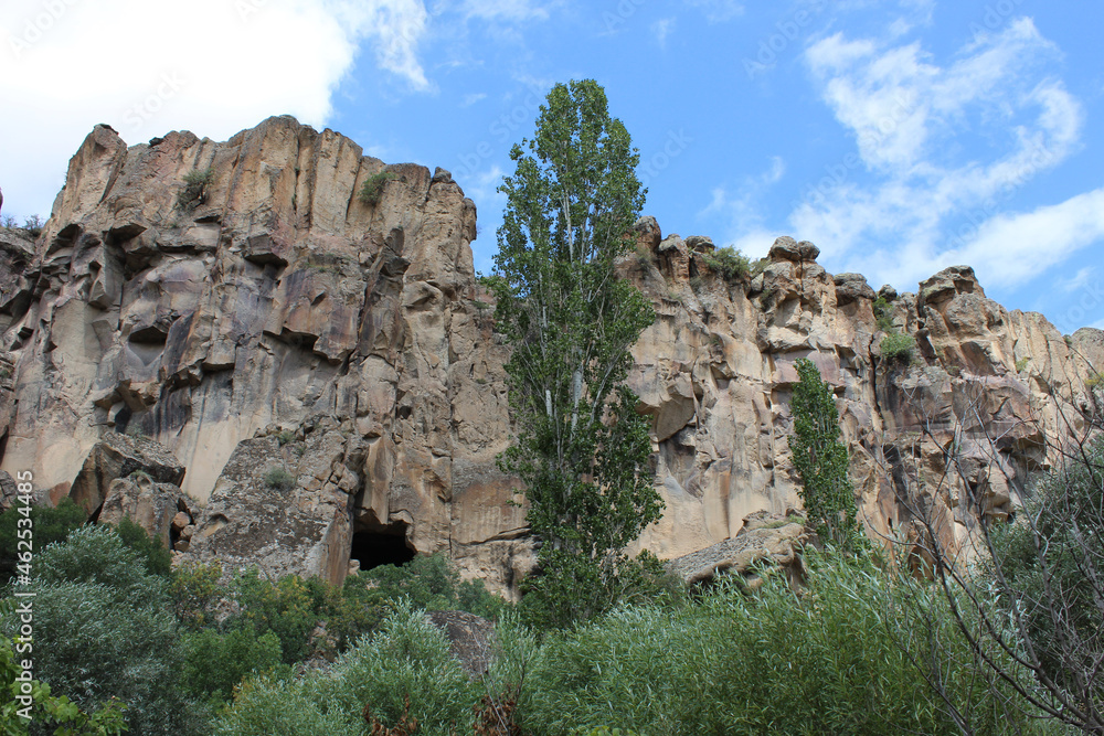 high gray rocks, aiming at the bright blue sky