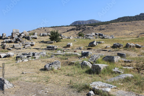 gray stones of regular shape, perhaps the remains of ancient graves