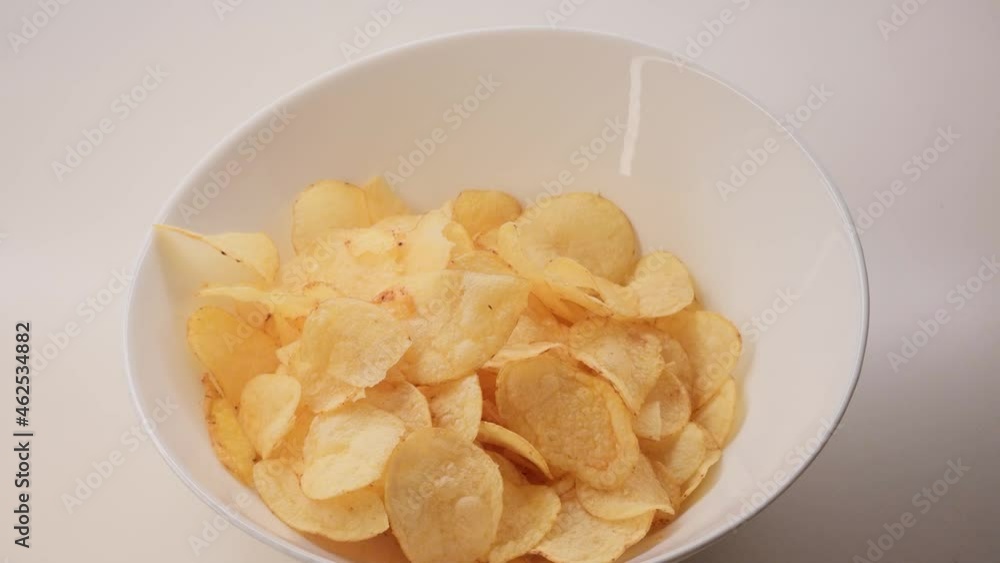 8K Potato chips in a white bowl. Conceptual junk food addiction.
Speed ramp from normal seed to timelapse. 8K Potato chips in a white bowl. Conceptual junk food addiction.
Speed ramp from normal seed to timelapse.