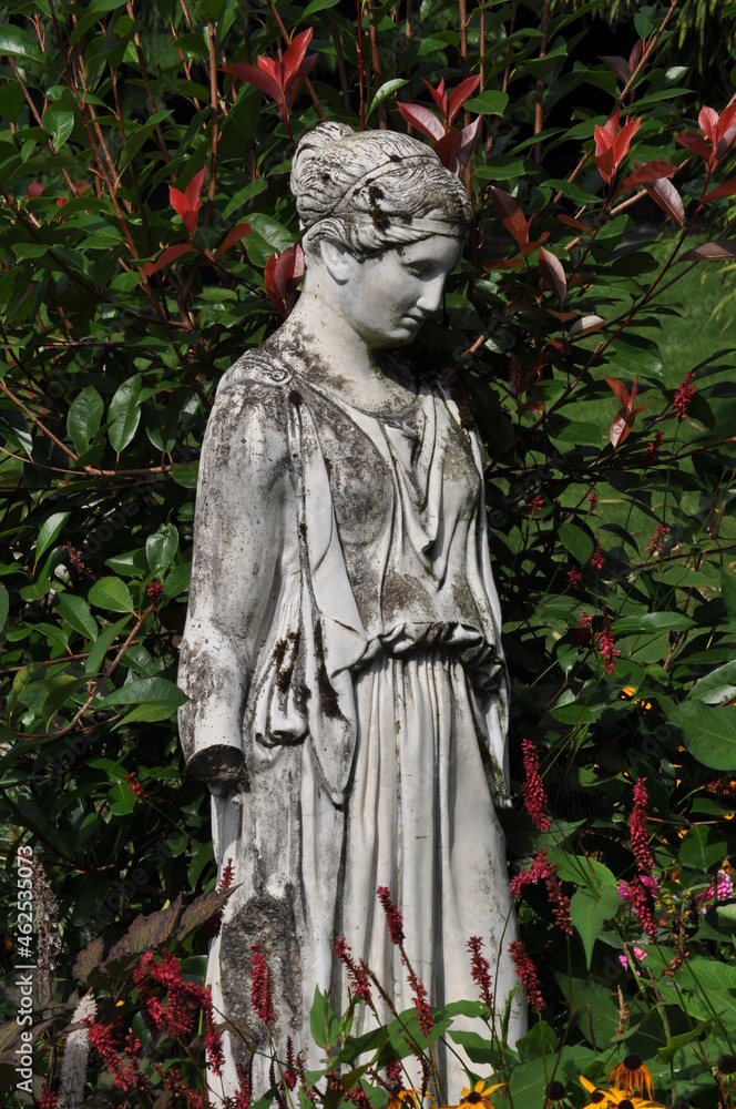Goddess statue in botanical summer garden