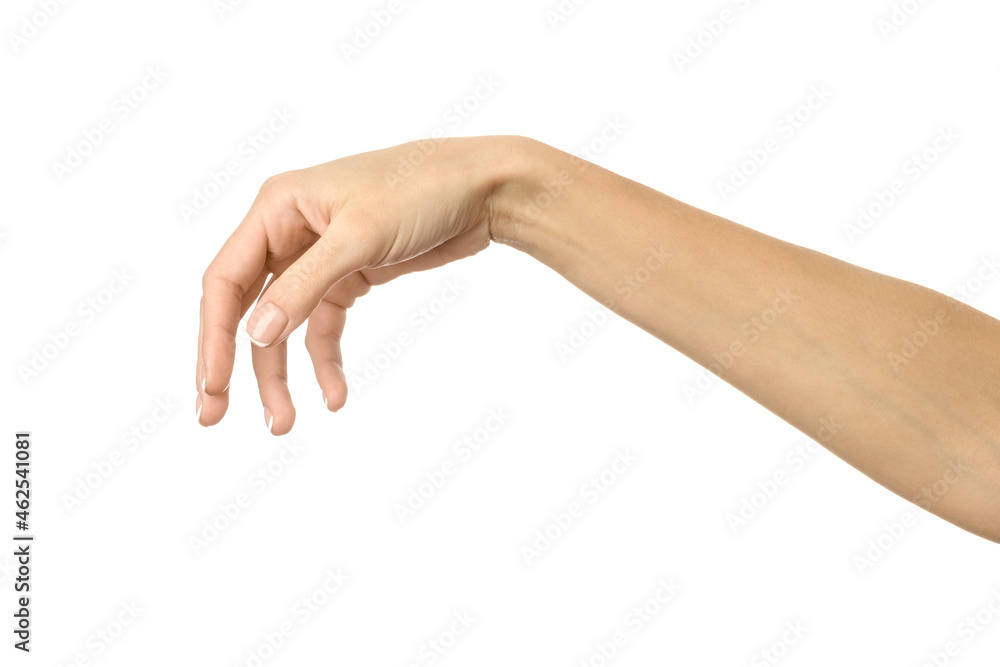Hand picking, holding, grabbing or reaching. Woman hand gesturing isolated on white Hand picking, holding, grabbing or reaching. Woman hand gesturing isolated on white