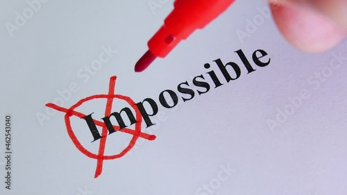 Remove word Impossible to read possible. Concept for self belief, positive attitude and motivation. Hand crosses out part of text on white paper. Motivation concept for business. New idea or plan