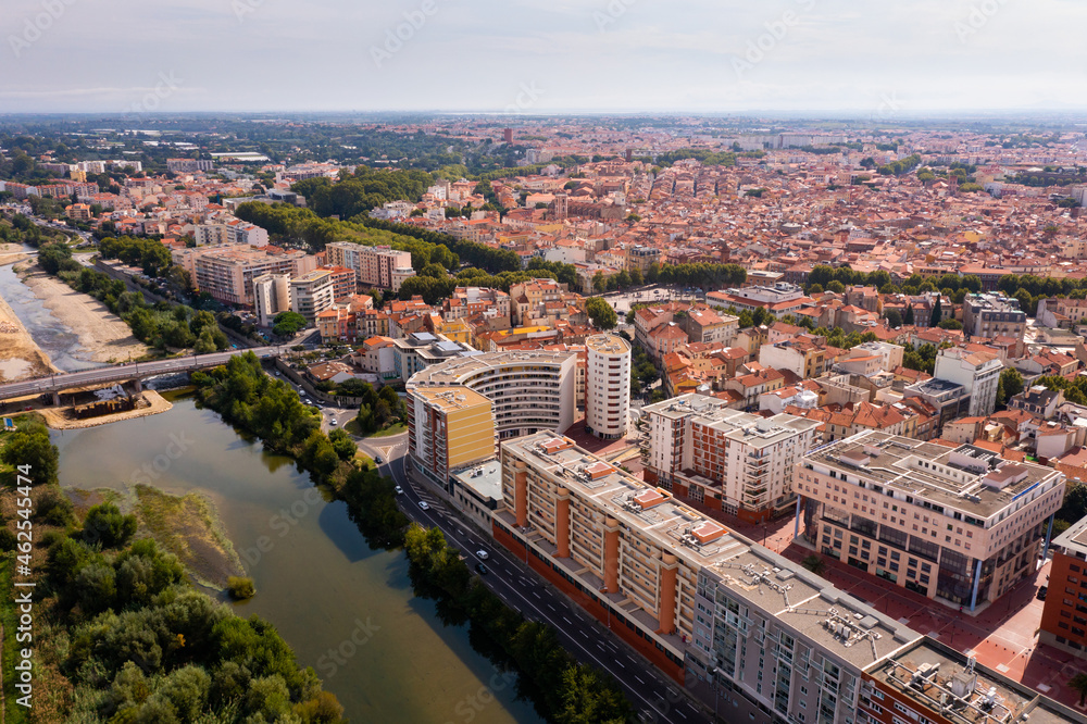 Panoramic view of Perpignan city center and Tet river on sunny day, France