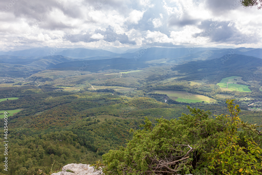 Obraz premium Travel along the mountain range and plateau in a picturesque area, on a summer day, communication with nature, a tourist quest.