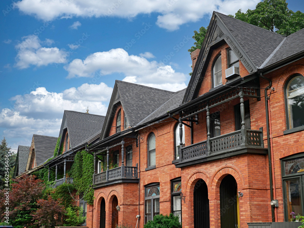 Row of attached Victorian houses with gables Row of attached Victorian houses with gables