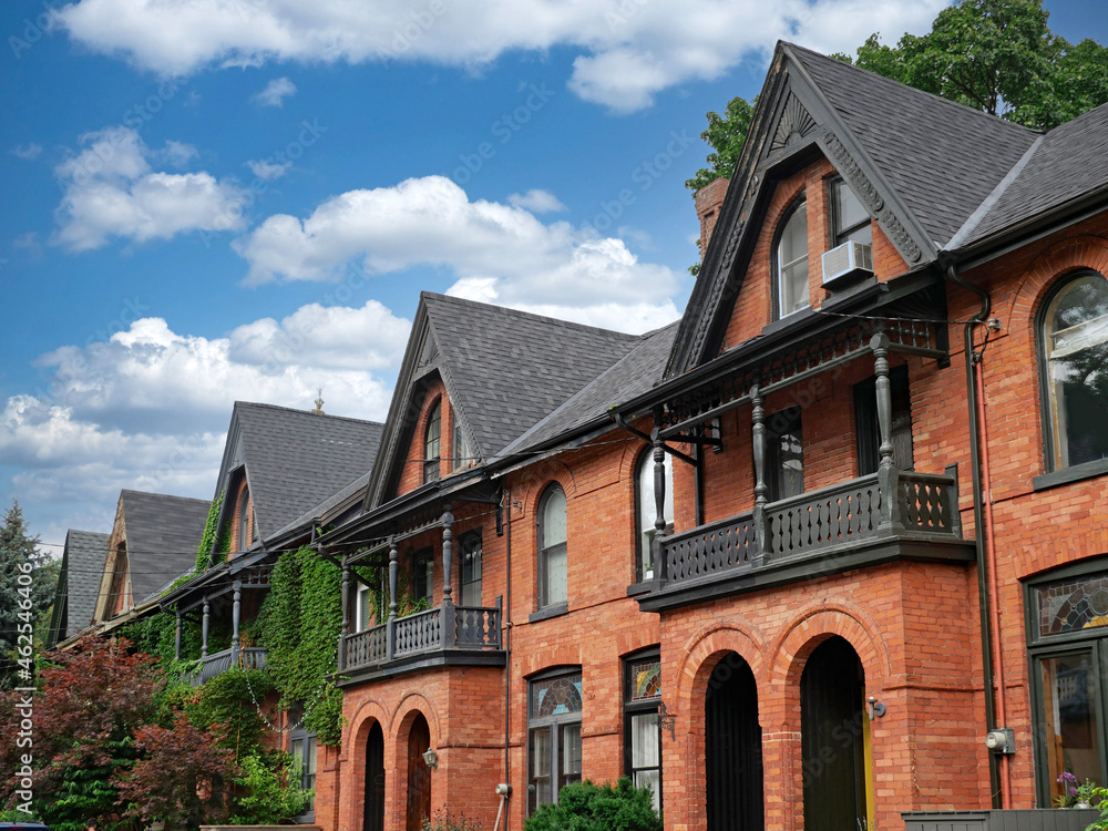 Row of attached Victorian houses with gables