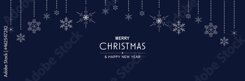 Merry Christmas and New Year 2022 poster. Xmas minimal banner design with hanging snowflakes and text on blue background. Horizontal festive header of website. Vector illustration for greeting card