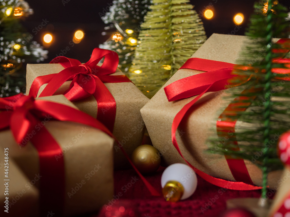 Close up of christmas presents and decorations against bokeh lights background. Close up of christmas presents and decorations against bokeh lights background.