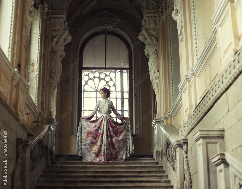 woman standing on the top of a stairway woman standing on the top of a stairway