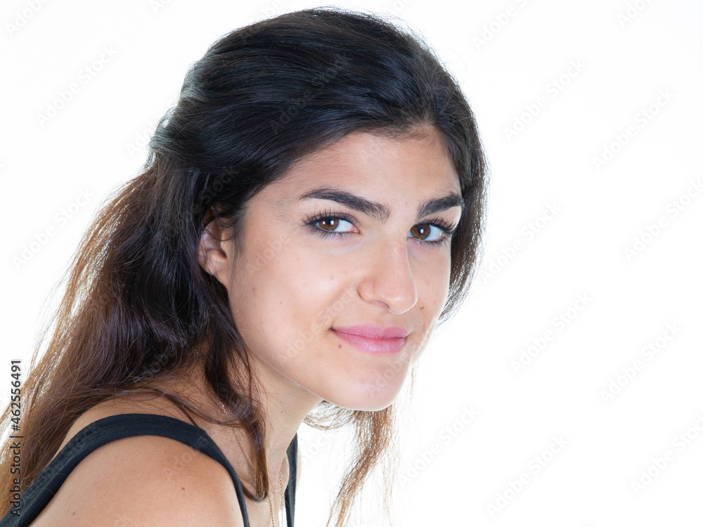 Pretty young woman with long brunette hair isolated against white studio background Pretty young woman with long brunette hair isolated against white studio background