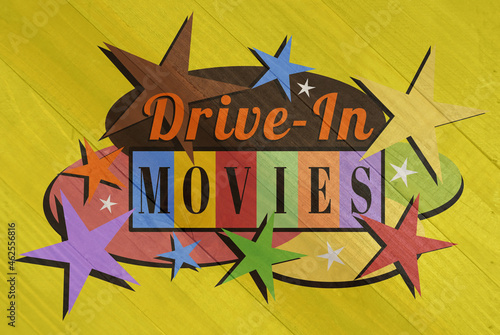 Vintage drive-in movies label on wood grain texture photo