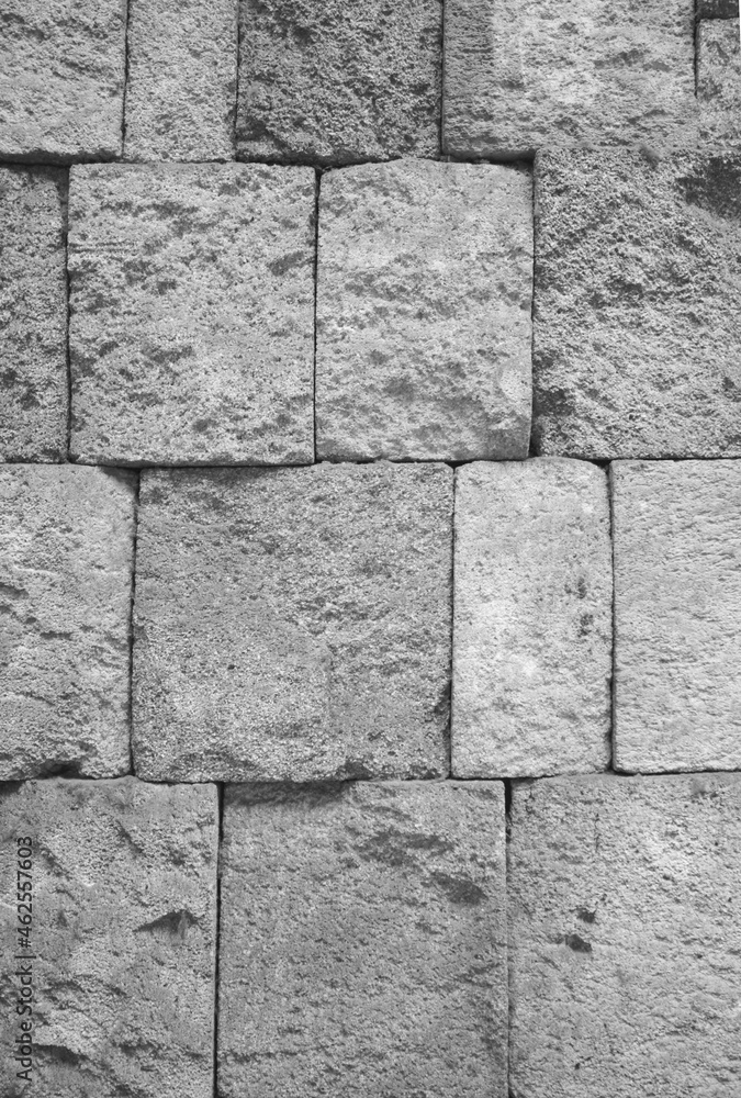 Fototapeta premium Massive masonry wall texture. Antique granite stone wall background.