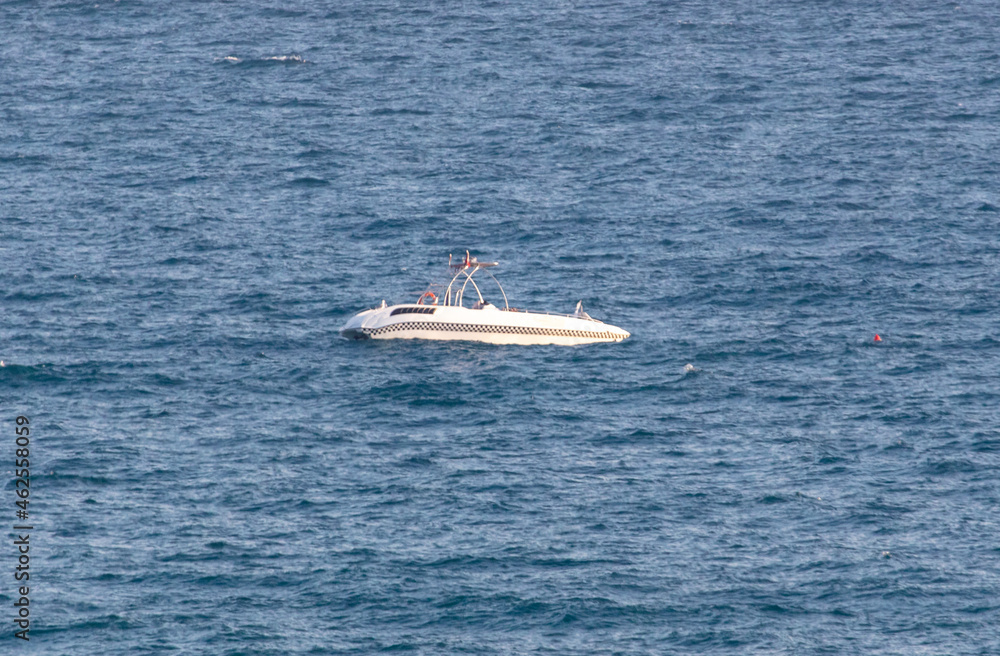 Fototapeta premium Boat on the waves of the sea.