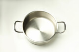 Metal empty pot on white background, above view