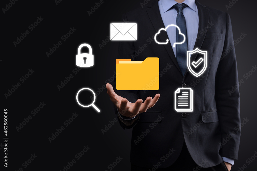 Document Management System DMS .Businessman hold folder and document icon.Software for archiving, searching and managing corporate files and information.Internet Technology Concept.Digital security Document Management System DMS .Businessman hold folder and document icon.Software for archiving, searching and managing corporate files and information.Internet Technology Concept.Digital security
