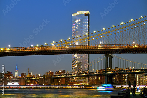 Brooklyn Bridge and Manhattan Bridge in evening, suspension bridges that crosses East River in New York City, United States © valeriyap
