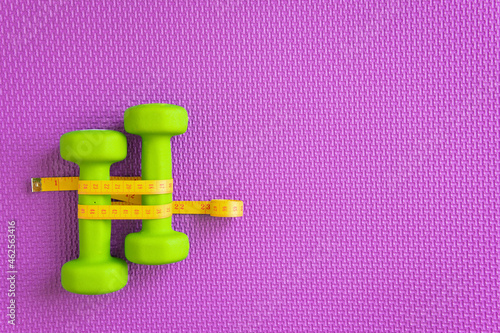 Dumbbells on background. The concept of a healthy lifestyle. photo